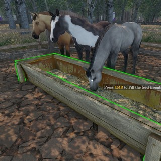 Real gameplay screenshot: unarmored foals feeding at a trough in a fenced paddock